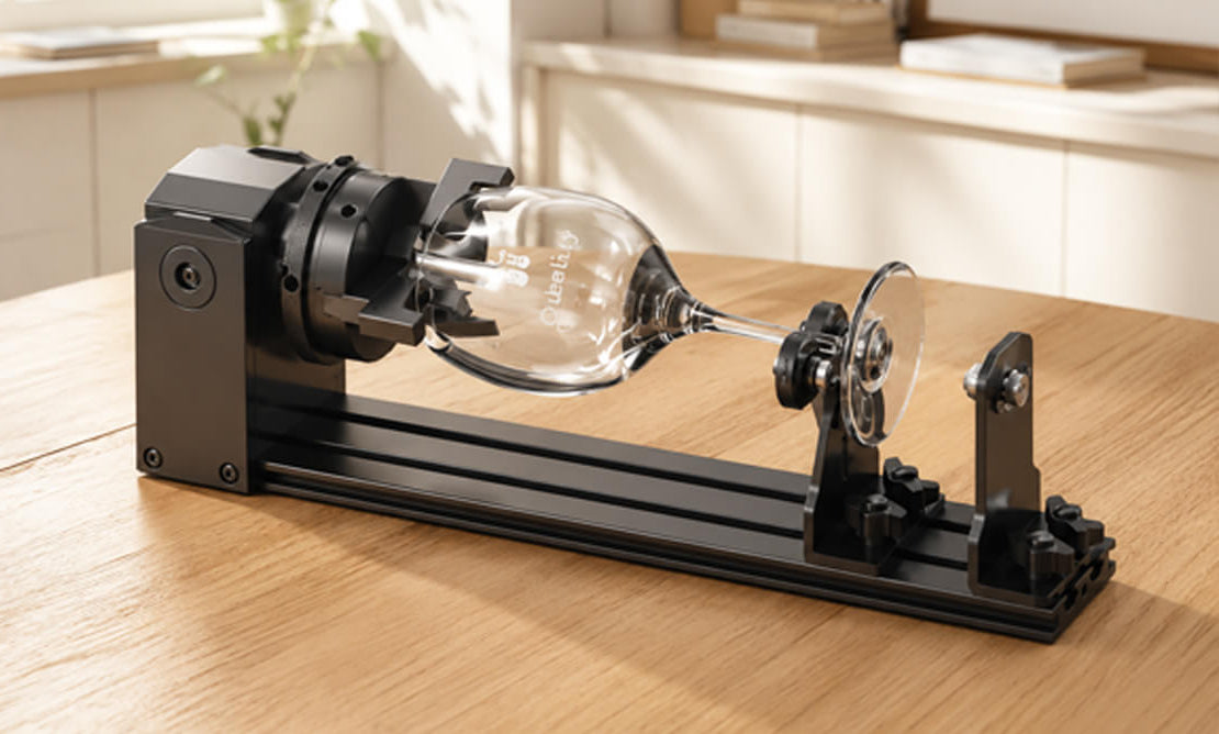 A black metal wall-mounted wine glass holder with a clear glass wine glass suspended in the center, shown against a light wood wall in an indoor setting.